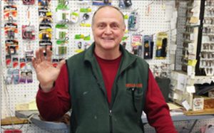 Original Puritas photograph of a team member at the hardware counter